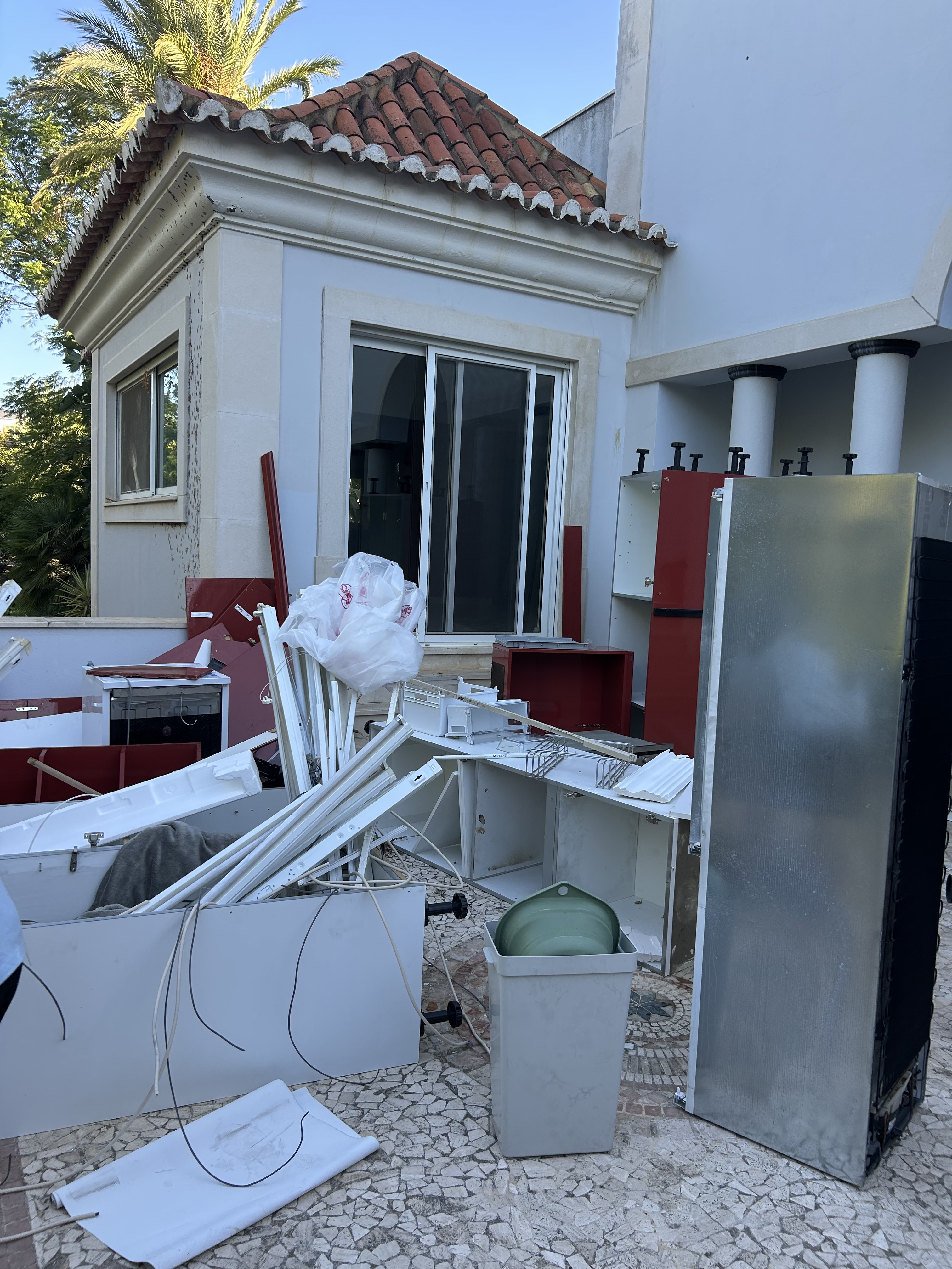 Waste and dismantled furniture before clearance in Almancil