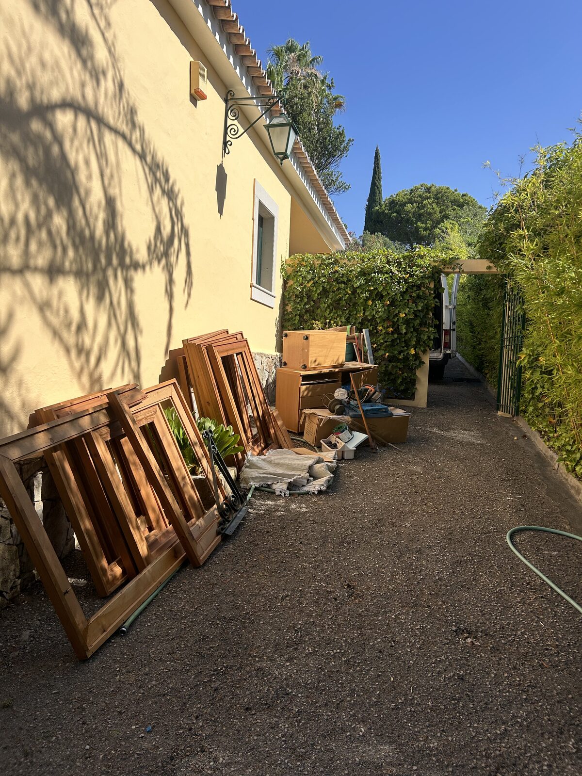 Whitehouse Services removal team loading old furniture into the van at an Algarve villa